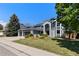 Charming two-story home with a three car garage, landscaped yard, and a modern exterior design at 9382 Lark Sparrow Dr, Highlands Ranch, CO 80126