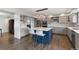 Open kitchen with gray cabinets, stainless steel appliances, and a spacious island at 9382 Lark Sparrow Dr, Highlands Ranch, CO 80126