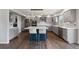 Open kitchen with island, stainless steel appliances, and gray cabinets at 9382 Lark Sparrow Dr, Highlands Ranch, CO 80126