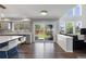 Modern eat-in kitchen with stainless appliances, granite counters, backyard access, and lots of natural light at 9382 Lark Sparrow Dr, Highlands Ranch, CO 80126