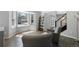 Bright living room with wood floors, large windows, and stylish furniture for a cozy atmosphere at 9382 Lark Sparrow Dr, Highlands Ranch, CO 80126