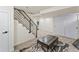 Finished basement with sitting area and stairs at 2826 W Park Pl, Denver, CO 80219