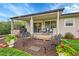 Cozy covered patio with outdoor seating, perfect for relaxing and entertaining in the backyard at 3450 W Amherst Ave, Denver, CO 80236