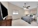 Comfortable bedroom with a ceiling fan, neutral color scheme, and a soft rug at 3450 W Amherst Ave, Denver, CO 80236