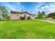 Charming home with a well-kept lawn, attractive landscaping, and a paved driveway, showcasing curb appeal at 3450 W Amherst Ave, Denver, CO 80236
