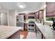 Well-equipped kitchen with stainless steel appliances, ample counter space, and modern cabinets at 3450 W Amherst Ave, Denver, CO 80236