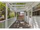 A beautiful outdoor space for relaxing with a pergola and wooden deck overlooking a lush green backyard at 400 Holly St, Denver, CO 80220