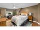 Comfortable bedroom featuring a queen bed, desk area, and natural light, creating a cozy retreat at 400 Holly St, Denver, CO 80220