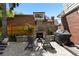 Cozy outdoor fireplace with comfortable seating, ideal for relaxing evenings and outdoor grilling at 400 Holly St, Denver, CO 80220