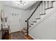 Foyer with hardwood floors, staircase and decorative details at 400 Holly St, Denver, CO 80220