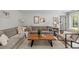Inviting living room with a comfortable sectional sofa, stylish decor, and plenty of natural light at 400 Holly St, Denver, CO 80220