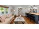 Comfortable living room with hardwood floors, stylish furniture and an open floor plan at 400 Holly St, Denver, CO 80220