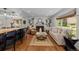 Inviting living room featuring hardwood floors, fireplace, built-in shelves and open layout at 400 Holly St, Denver, CO 80220
