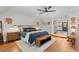 Spacious main bedroom with ensuite access and hardwood floors at 400 Holly St, Denver, CO 80220