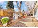 Backyard featuring a patio area, grill, and lush greenery, perfect for outdoor entertaining at 4145 Dudley St, Wheat Ridge, CO 80033
