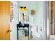 Charming bathroom with modern fixtures, unique lighting, and custom mirror at 4145 Dudley St, Wheat Ridge, CO 80033