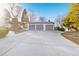 Charming home with an attached three-car garage, offering ample parking and storage space for a modern lifestyle at 4145 Dudley St, Wheat Ridge, CO 80033