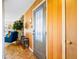 Inviting foyer with wood paneled wall and a view of the living room, creating a warm and welcoming atmosphere at 4145 Dudley St, Wheat Ridge, CO 80033