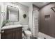 Modern bathroom featuring a walk-in shower, updated vanity, and stylish fixtures at 4830 Monarch Dr, Firestone, CO 80504