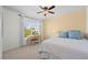 Inviting bedroom featuring a white bed set, natural light, and small writing desk at 4830 Monarch Dr, Firestone, CO 80504