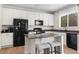 Stylish kitchen with granite countertops, stainless steel appliances, and a breakfast bar with seating at 4830 Monarch Dr, Firestone, CO 80504
