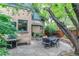 Cozy backyard patio with stone pavers, outdoor grill, lovely plants and relaxing outdoor seating at 3701 Eliot St, Denver, CO 80211