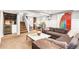 Finished basement with a wet bar, seating area, and neutral decor at 3701 Eliot St, Denver, CO 80211