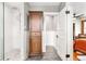 Recently remodeled bathroom featuring glass shower, and wood storage unit at 3701 Eliot St, Denver, CO 80211