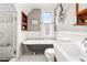 Stylish bathroom featuring a clawfoot tub, subway tile shower, and decorative accents at 3701 Eliot St, Denver, CO 80211