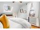 Bright bedroom with a skylight, wooden accents, and neutral decor at 3701 Eliot St, Denver, CO 80211