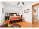 Warm, cozy bedroom with hardwood floors and ample closet space at 3701 Eliot St, Denver, CO 80211