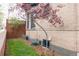 Exterior side of home with lawn and landscaping, features a classic brick design at 3701 Eliot St, Denver, CO 80211