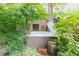 Relaxing hot tub surrounded by lush greenery, offering a private outdoor oasis at 3701 Eliot St, Denver, CO 80211