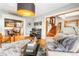 Spacious living room showcasing hardwood floors, stylish furnishings, and natural light at 3701 Eliot St, Denver, CO 80211