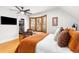 Spacious bedroom with bay window, walk-in closet, and an elegant leather chair at 3701 Eliot St, Denver, CO 80211