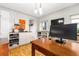 Bright office area featuring custom built-ins, hardwood floors, and modern lighting at 3701 Eliot St, Denver, CO 80211