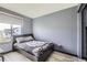 Bedroom with double bed and gray walls at 5126 Elkhart St, Denver, CO 80239