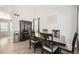 Dining area with dark wood table and chairs, and neutral walls at 5126 Elkhart St, Denver, CO 80239