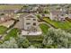 Aerial view of a home with a well-maintained lawn, patio, and back deck in a residential neighborhood at 3620 Sandoval St, Brighton, CO 80601