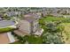 Aerial view of a two-story home featuring a patio, deck, lush lawn, and surrounding neighborhood at 3620 Sandoval St, Brighton, CO 80601