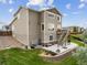 Two-story home featuring a patio, deck, landscaping, and lush green yard at 3620 Sandoval St, Brighton, CO 80601