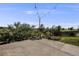 Spacious backyard patio with string lights, landscaping, and an open view, great for entertaining at 3620 Sandoval St, Brighton, CO 80601