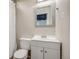 Functional bathroom with a vanity sink, toilet, and shower with curtain at 3620 Sandoval St, Brighton, CO 80601