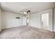 Spacious bedroom with neutral carpeting, a ceiling fan, and a TV mount at 3620 Sandoval St, Brighton, CO 80601