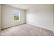 Bright bedroom with a large window and plush carpeting at 3620 Sandoval St, Brighton, CO 80601