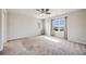 Bright, neutral bedroom with neutral carpet, large windows, and ample natural light at 3620 Sandoval St, Brighton, CO 80601
