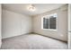 Neutral bedroom features a large window and neutral carpet at 3620 Sandoval St, Brighton, CO 80601