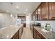 Spacious kitchen features stainless steel appliances, granite countertops, and wood cabinets at 3620 Sandoval St, Brighton, CO 80601
