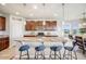 Bright kitchen featuring granite countertops, stainless steel appliances, and stylish pendant lighting at 3620 Sandoval St, Brighton, CO 80601
