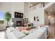 Cozy living room with fireplace and a two-story ceiling at 3620 Sandoval St, Brighton, CO 80601